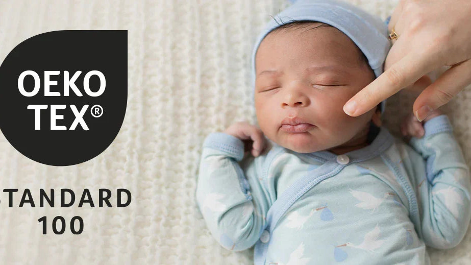 OKEO TEX logo with sleeping baby