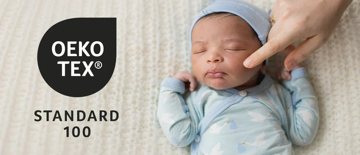OKEO TEX logo with sleeping baby